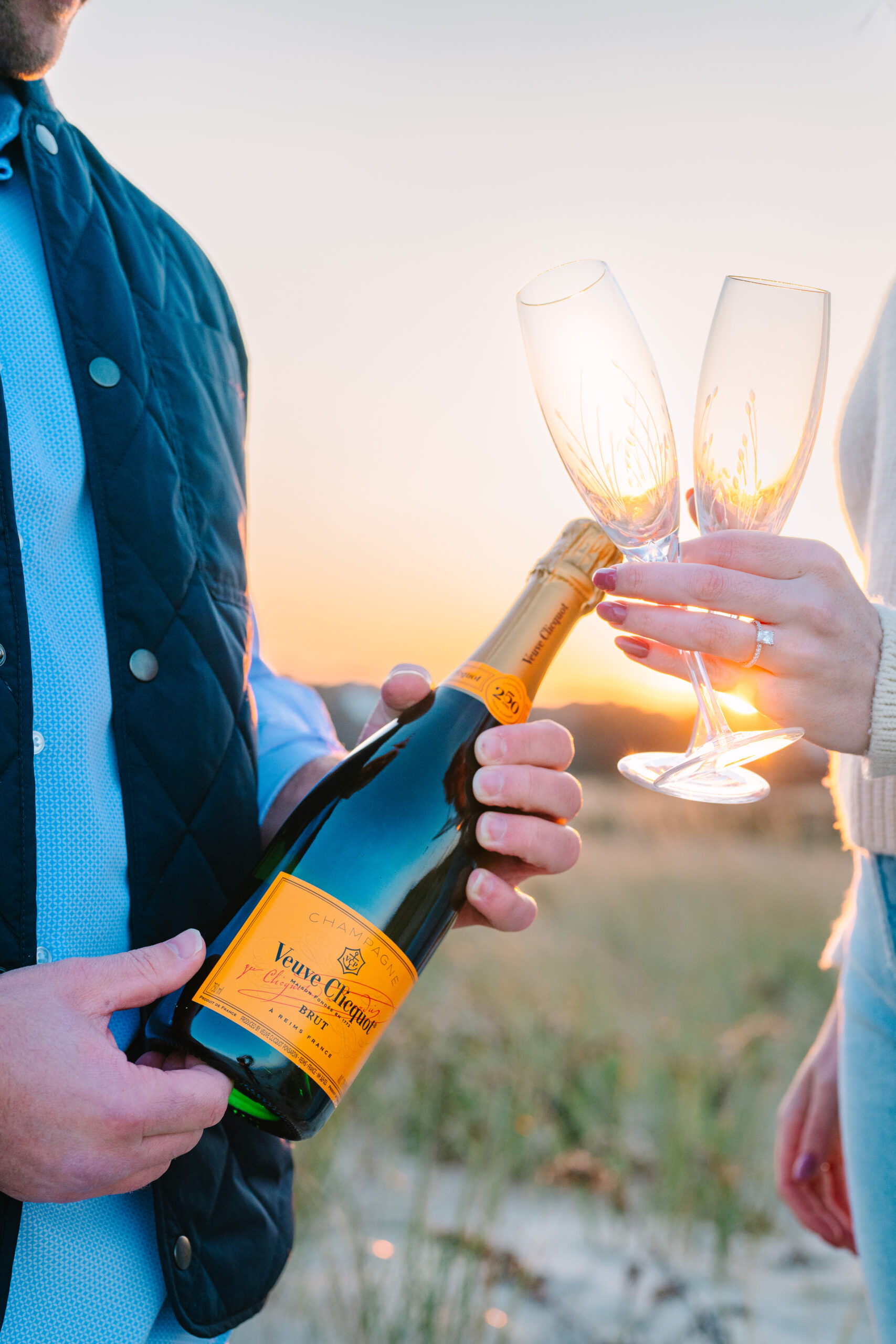 Engagement session with champagne on cape cod beach